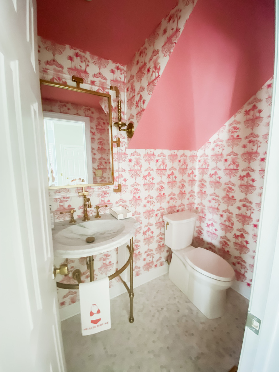 Rust Half Bathroom - Pink maximalist wallpaper, gold accents, console sink